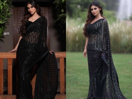 Mouni Roy`s black sari is perfect to make a statement at your Bhai ki shaadi!