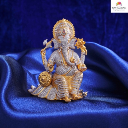 Unveiling the Spectacular Gold and Swarovski Crystal Stones of Lord Ganesh Murti by  Navrathan Jewellers