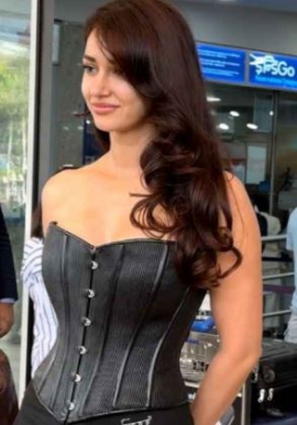 Disha Patani wears pleated micro mini skirt at Mumbai airport; keeps travel style sexy
