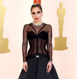 Lady Gaga wows Oscars in fresh off the runway Versace gown