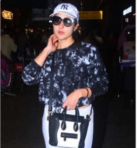 Sara Ali Khan serves fashion goals with her airport look as she carries a Celine monochrome handbag in style