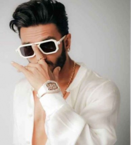 Ranveer Singh looks like a modern-day Victorian prince in unbuttoned shirt, striped trousers with accessories