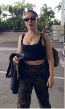 Airport Style: Tamannaah Bhatia wears camo print cargo pants and black crop top with plunging neckline
