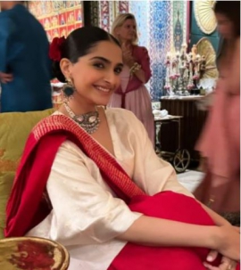 Elevate your fusion wear game with Sonam Kapoor Ahuja’s unique merge of kaftan with stylish red saree