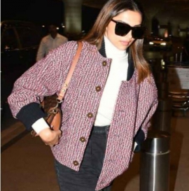 Deepika Padukone makes a statement by layering her airport fit with Rs. 4.15 lacs red oversized tweed jacket