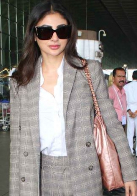 Mouni Roy makes a case for power dressing with her airport look in grey pantsuit and Rs 5.77 lacs Chanel bag