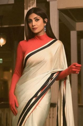 Shilpa Shetty`s full-sleeved red blouse with a printed saree showcases the power of desi dressing